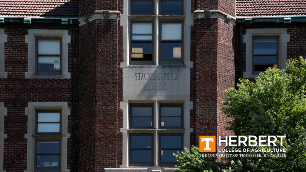 A close-up of the front of Morgan Hall with the Herbert College of Agriculture logo in the bottom right corner